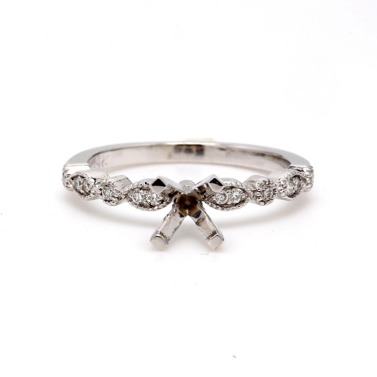 Semi-mount with shared prong set round diamonds.  D0.14ct.t.w.  Size 6.75
