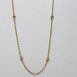 18' Diamonds by the yard necklace in yellow gold with bezel set (10) round diamonds.  D0.49ct.t.w.