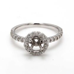 Halo semi-mount with U-prong set round diamonds.  D0.48ct.t.w.