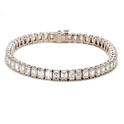 7' Tennis bracelet in platinum with 4-prong set emerald cut diamonds.  D15.47ct.t.w.
