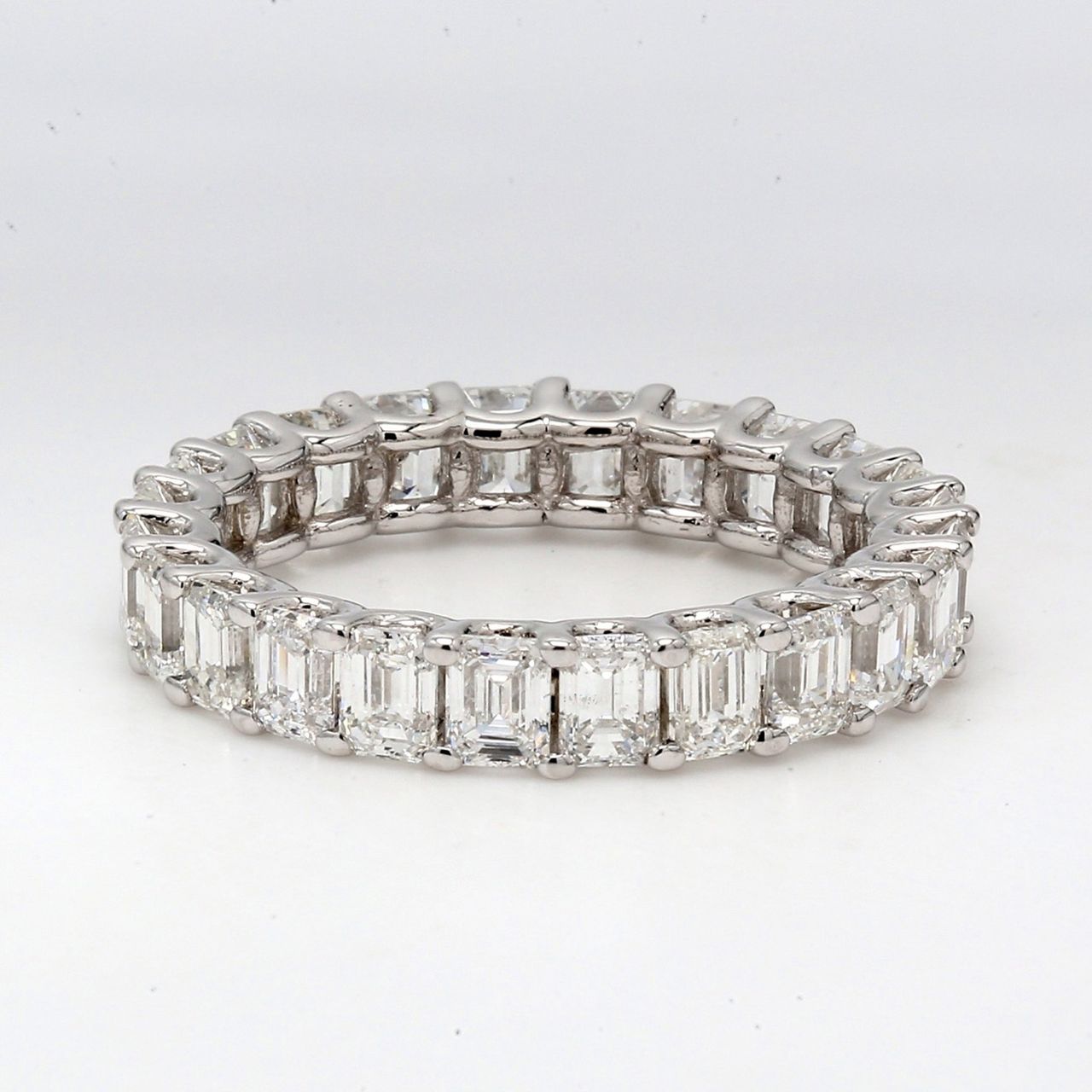 Eternity band with shared U-prong set (24) emerald cut diamonds.  D3.60ct.t.w.  Size 6