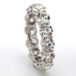 Eternity band in platinum with basket claw set (14) round diamonds.  D5.61ct.t.w.  Size 6.5
