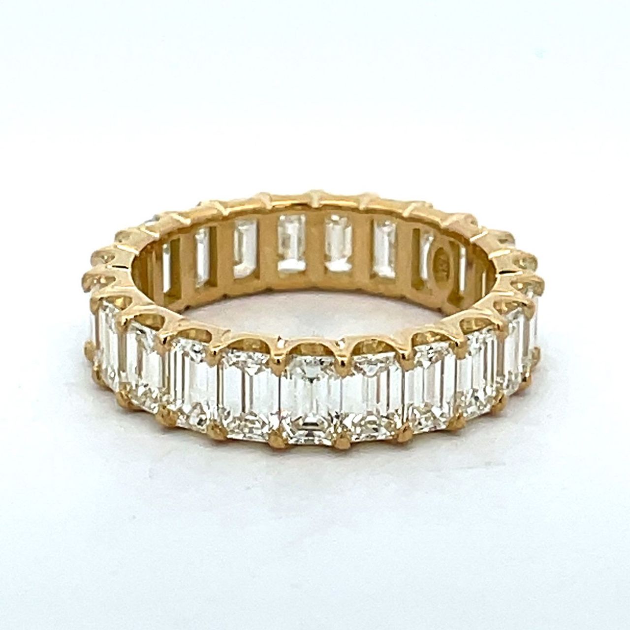 Eternity band in 18K YG with U-prong set (23) emerald cut diamonds.  D5.02ct.t.w.  Size 7