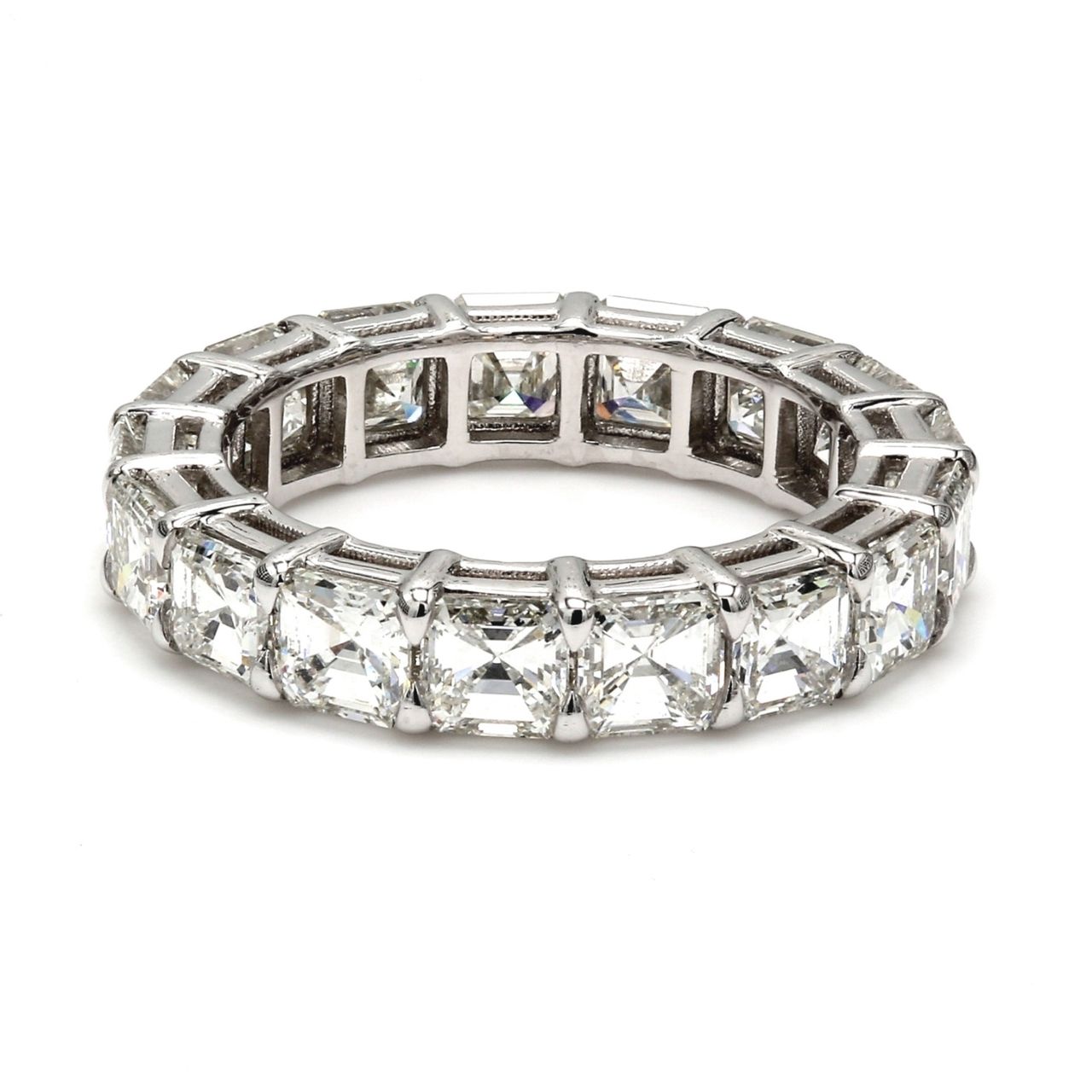 Eternity band in platinum with shared prong set (18) asscher cut diamonds.  D5.69ct.t.w.  Size 6.25