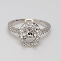 Halo semi-mount with bezel & pre-set round diamonds.  D0.48ct.t.w.