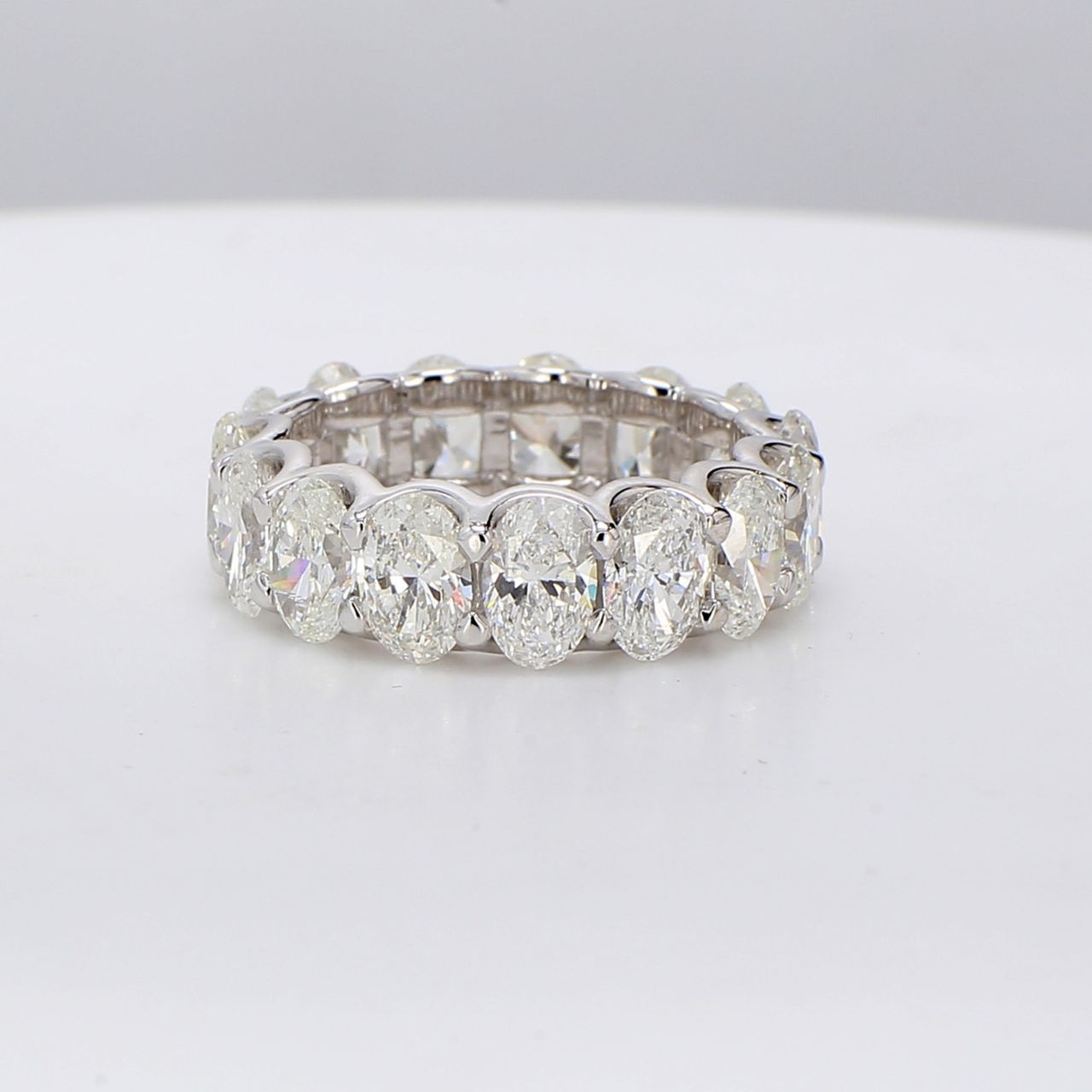 Eternity band in platinum with U-prong set G/SI (15) oval diamonds.  D7.88ct.t.w.  Size 7