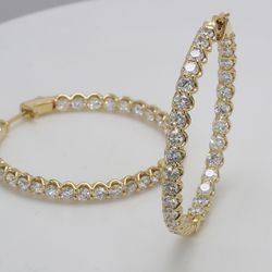 1.50' Inside out hoop earrings in 18K YG with U-prong set (62) round diamonds.  D6.51ct.t.w.