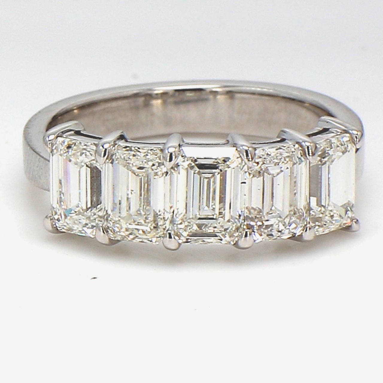 5-stone band in 18K WG with shared prong set GIA certified I/VVS1-VS2 emerald cut diamonds.  D2.59ct.t.w.  Size 5.75