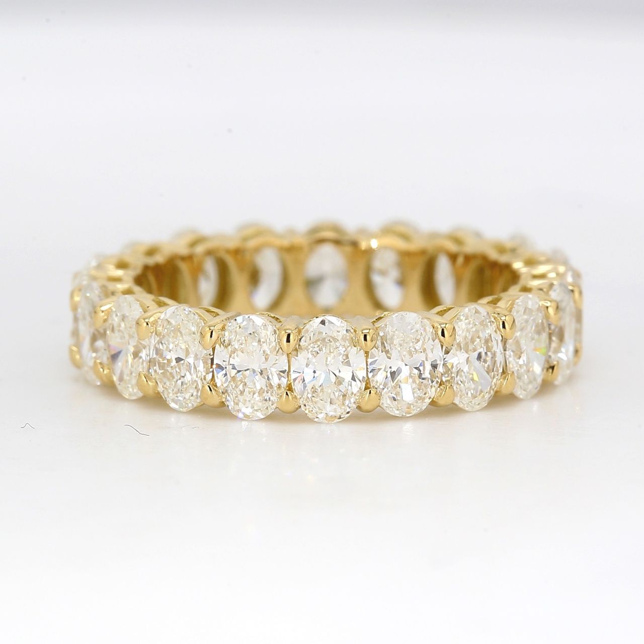 Eternity band in 18K YG with shared prong basket set oval diamonds.  D3.74ct.t.w.  Size 6