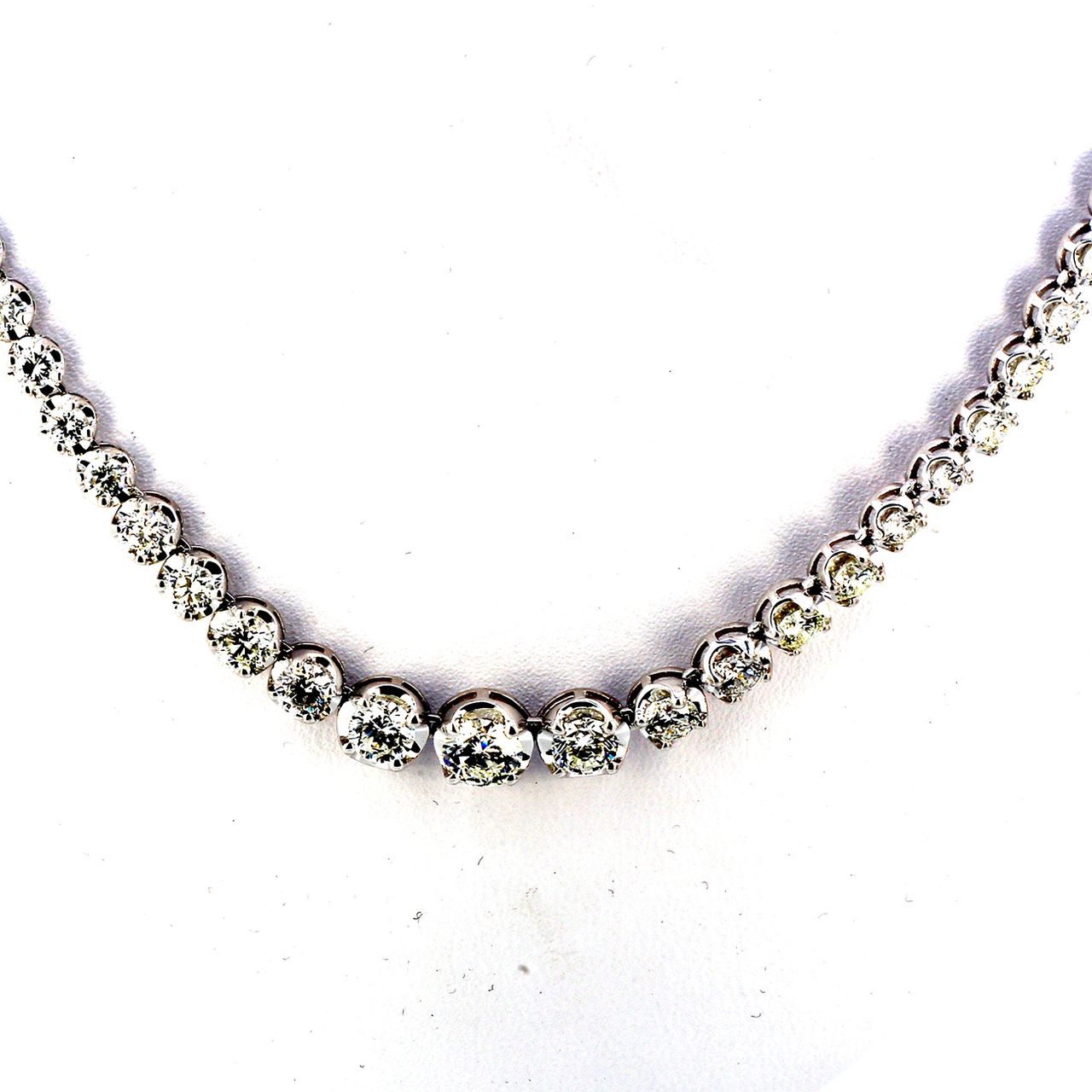 17' Graduating tennis necklace with basket crown head, prong set (107) round diamonds.  D10.20ct.t.w.  (Center - 0.63ct.)