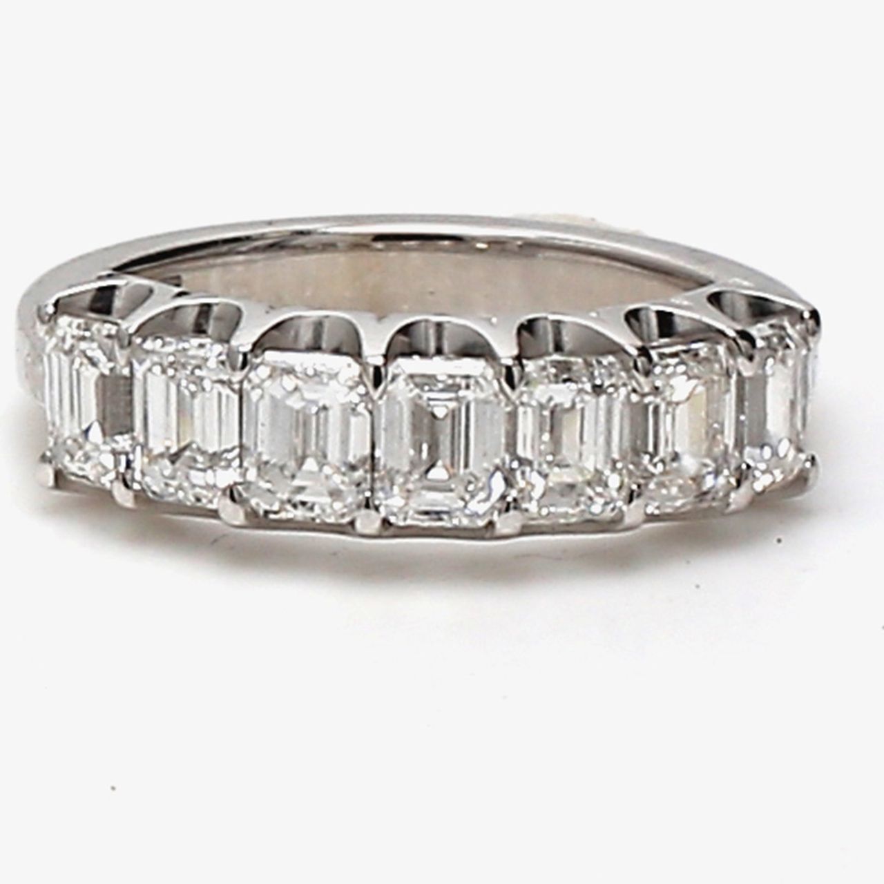 7-stone band in platinum with U-prong set emerald cut diamonds.  D1.69ct.t.w.  Size 4.75
