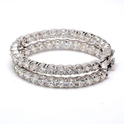 1.5' Inside out hoop earrings with prong set (52) round diamonds.  D9.69ct.t.w.