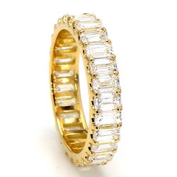 Eternity band in 18K YG with shared U-prong set (27) emerald cut diamonds.  D3.29ct.t.w.  Size 6.5