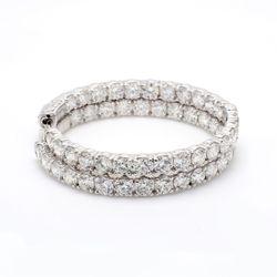 1.5' Inside out hoop earrings with shared prong set (52) round diamonds & with special spring lock.  D9.93ct.t.w.