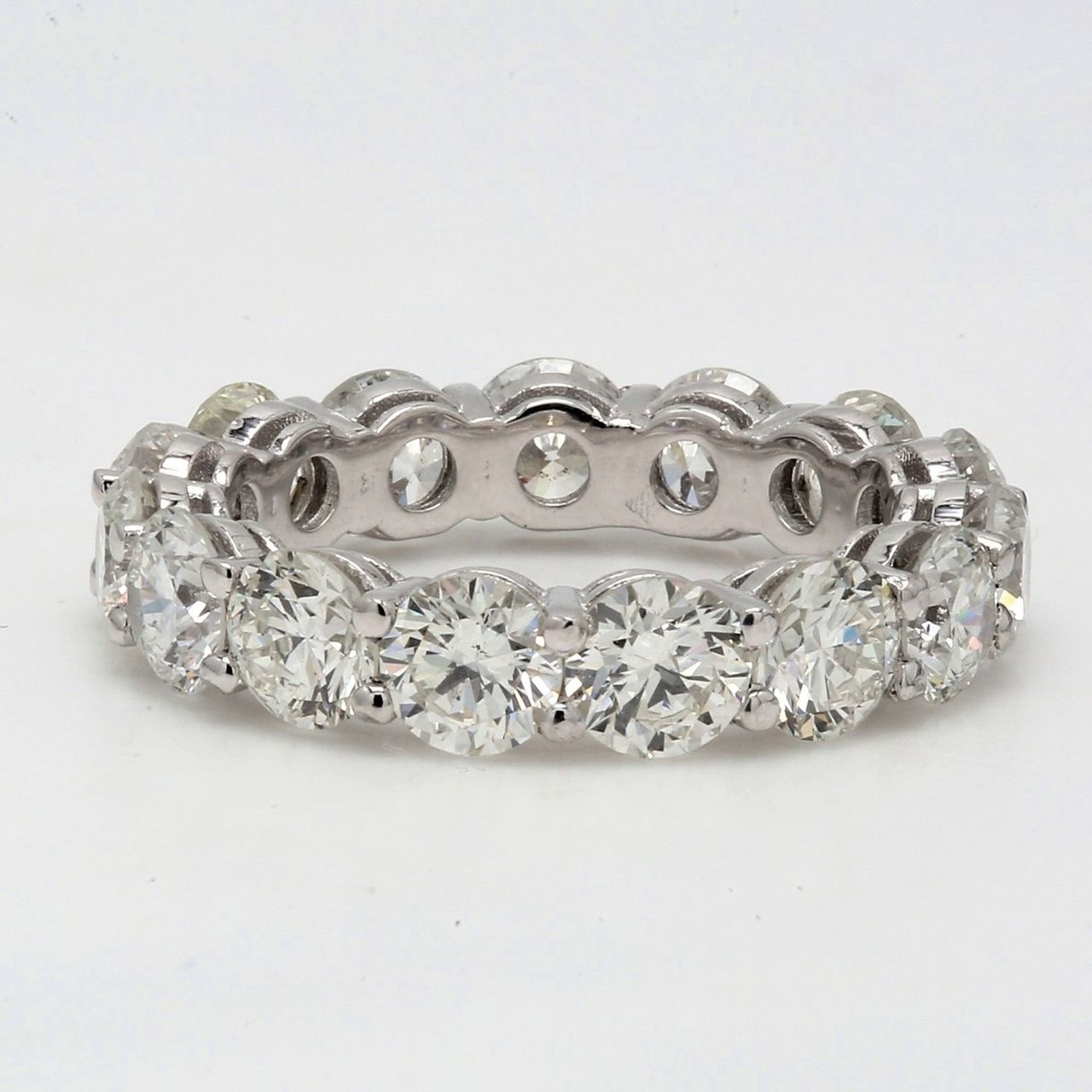 Eternity band in platinum with shared prong set round diamonds.  D5.11ct.t.w.  Size 5.75