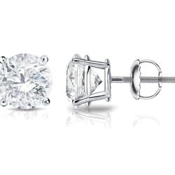 Screw back stud earrings with prong set round diamonds.  D3.01ct.t.w.