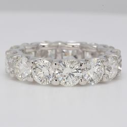 Eternity band in platinum with U-prong set round diamonds.  D6.11ct.t.w.  Size 5.25