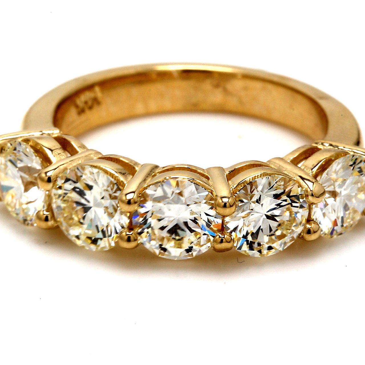 5-stone band in yellow gold with shared prong set round diamonds.  D2.98ct.t.w.  Size 6.25