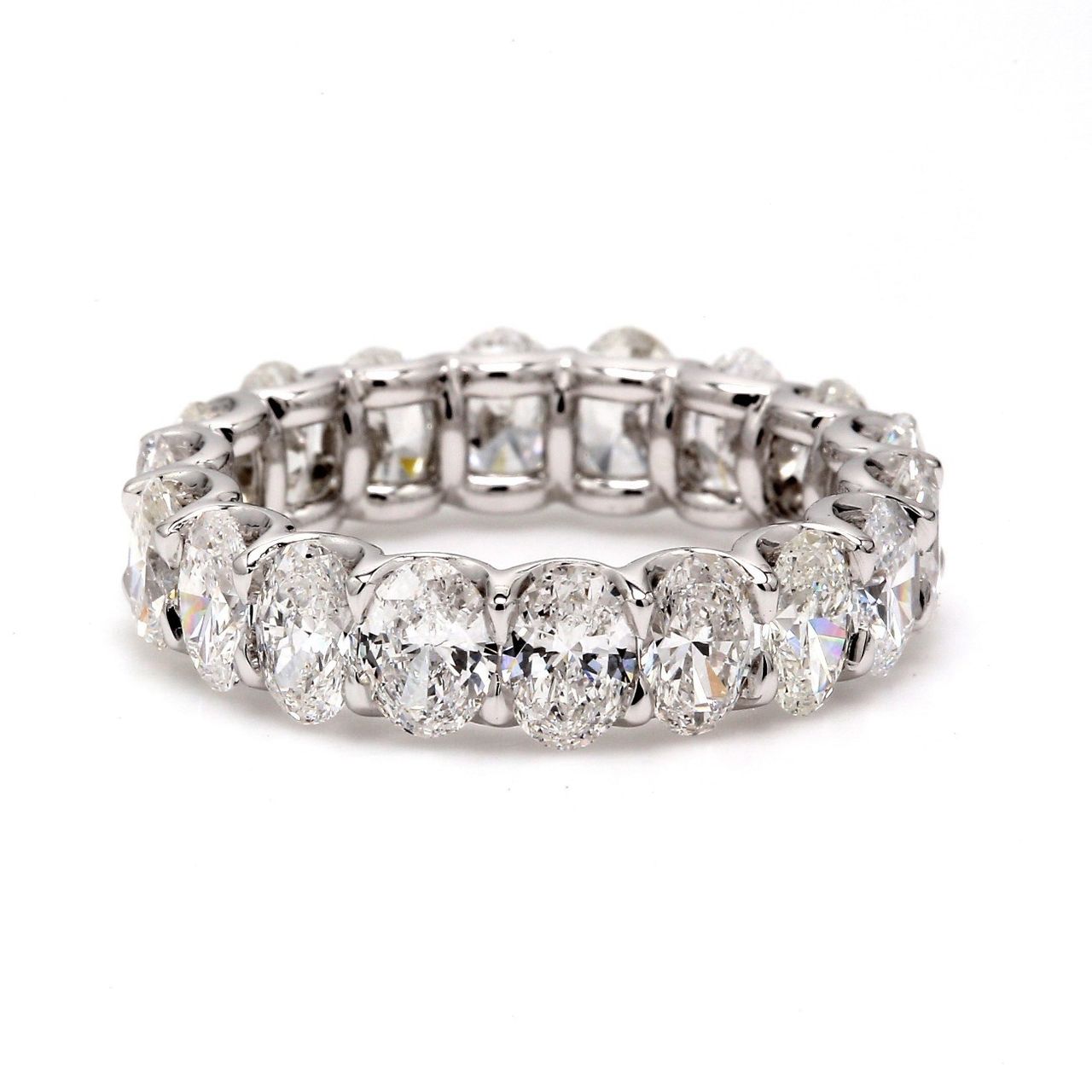 Eternity band in platinum with shared U-prong set E-F/VS1-VS2 oval diamonds.  D3.81ct.t.w.