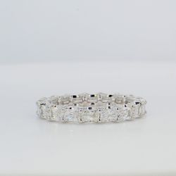 Eternity band east to west style in platinum with shared U-prong set radiant cut diamonds.  D2.80ct.t.w.  Size 7