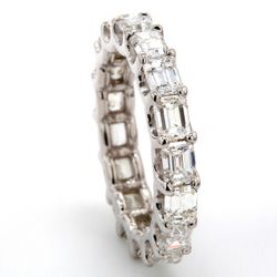East to west style eternity band with shared U-prong set (17) emerald cut diamonds.  D4.10ct.t.w.