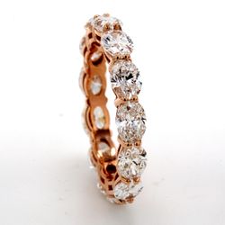 Eternity band east to west style in 18K RG with basket set (13) oval cut diamonds.  D3.14ct.t.w .  Size 5