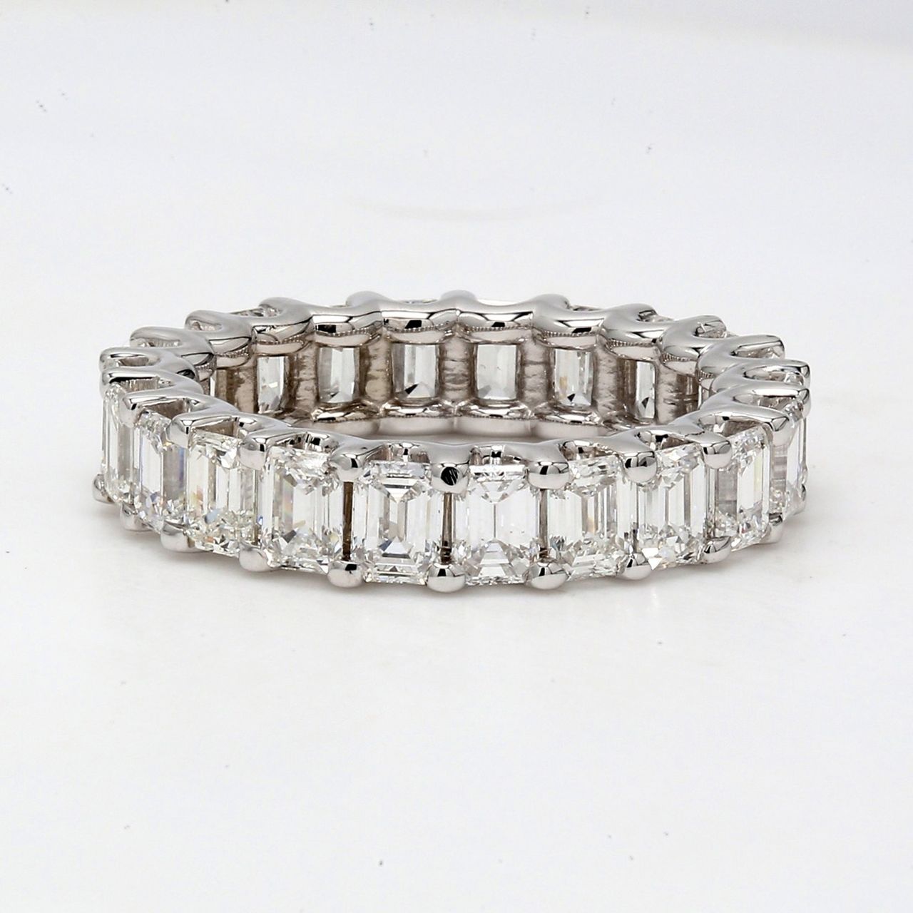 Eternity band with shared U-prong set (22) emerald cut diamonds.  D3.74ct.t.w.  Size 5