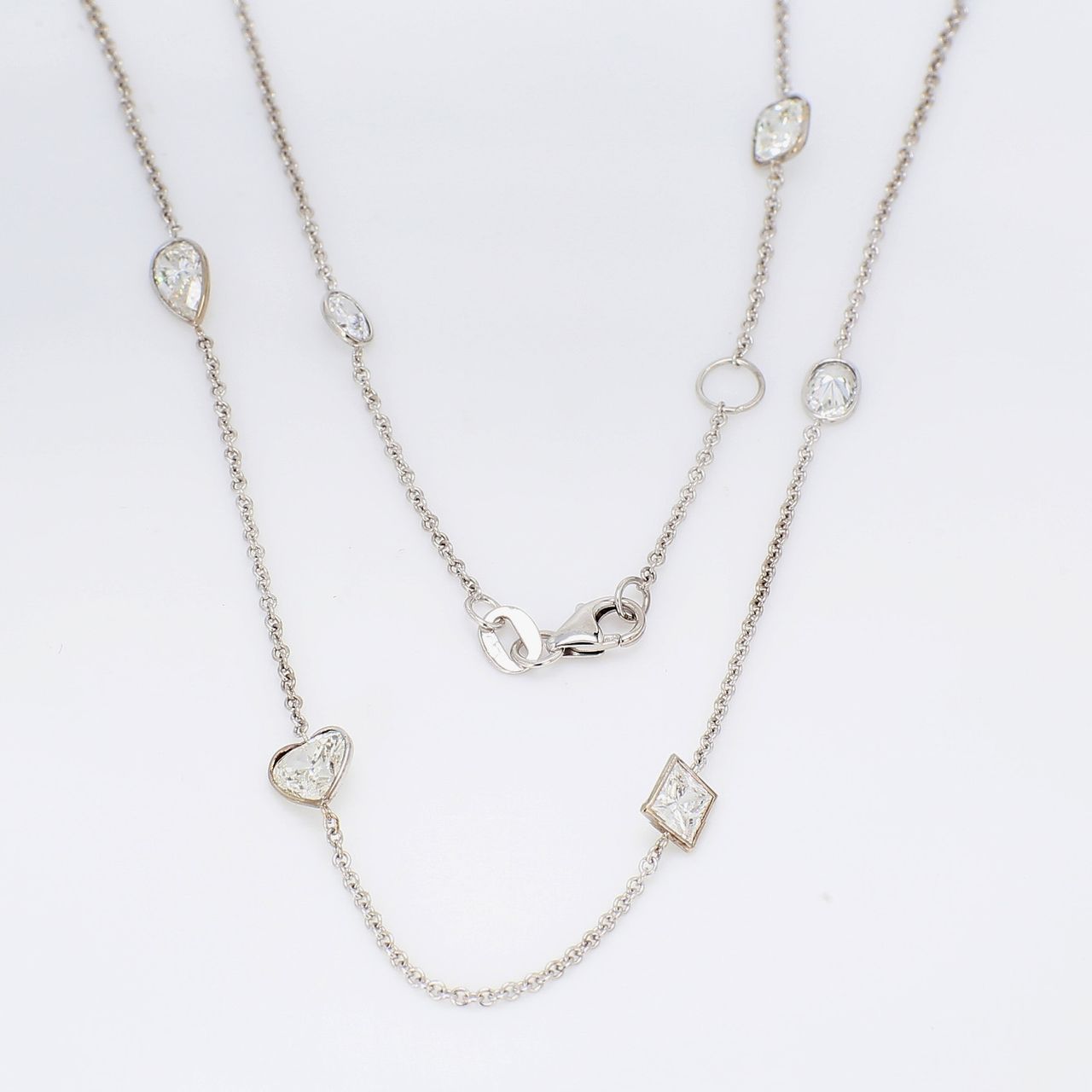 18' Diamonds by the yard necklace in 18K WG with bezel set assorted heart, princess, oval, & pear shape diamonds.  D3.55ct.t.w.