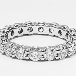 Eternity band in platinum with shared prong set (18) round diamonds.  D2.42ct.t.w.  Size 5.5