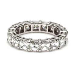 Eternity band in platinum with shared prong set (18) asscher cut diamonds.  D5.69ct.t.w.  Size 6.25