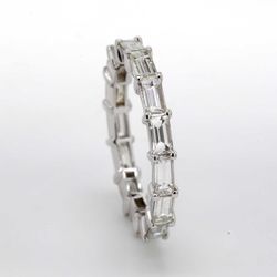 East to west style eternity band in 18K WG with shared prong set (15) baguette diamonds.  D1.75ct.t.w.  Size 4.75