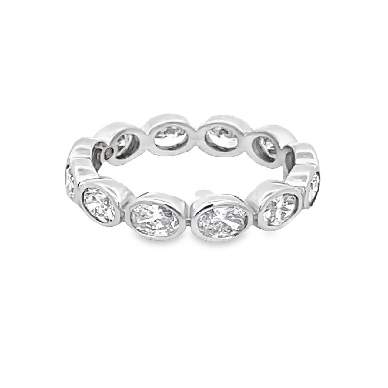 Eternity band east west style in 18K WG with bezel set (12) oval diamonds.  D1.61ct.t.w.  Size 6