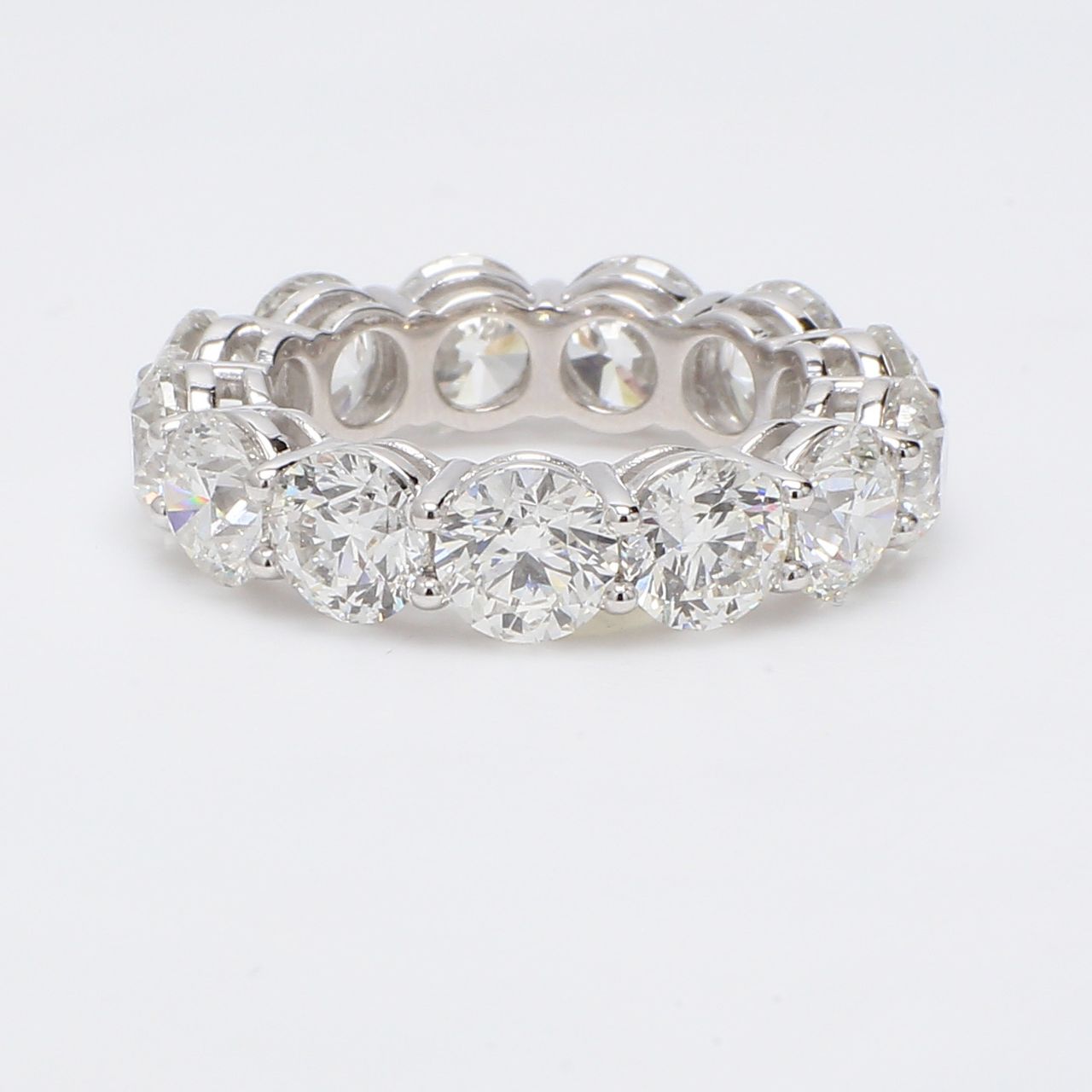 Eternity band in platinum with shared prong set round diamonds.  D9.16ct.t.w.