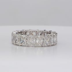 Eternity band in platinum with eagle claw prong basket set D-F/VVS1-VS2 (17) radiant cut diamonds.  D7.24ct.t.w.  Size 6.75