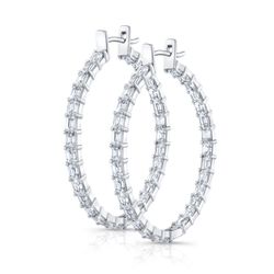 1.5' Oval shaped inside out hoop earrings east to west style with (48) emerald cut diamonds.  D6.12ct.t.w.