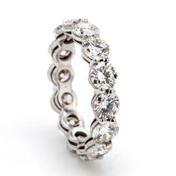 Eternity band with shared prong set (14) round diamonds.  D4.44ct.t.w.  Size 6.25
