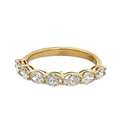 7-stone band east west style in 18K YG with prong set oval diamonds.  D0.96ct.t.w.  Size 5.75