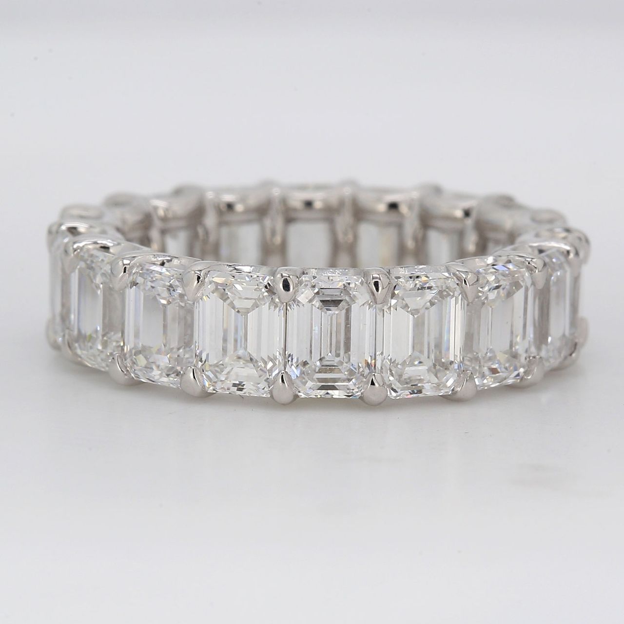 Eternity band in platinum with shapred U-prong set GIA certified D-F/IF-VS2 emerald cut diamonds.  D8.43ct.t.w.  Size 6.5