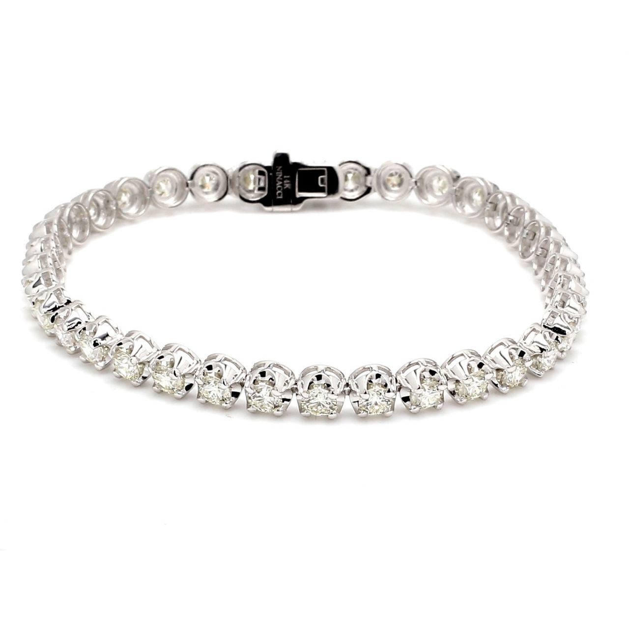 7' Tennis bracelet in 18K WG with crown head set G-H/VS2-SI1 (27) round diamonds.  D9.51ct.t.w.