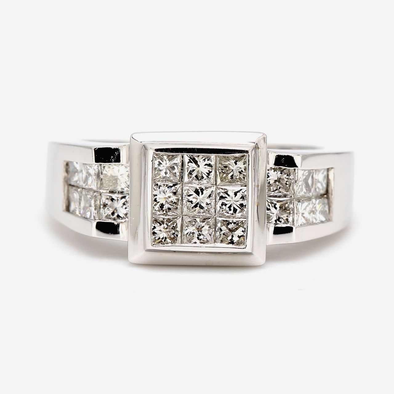Ring with 3x3 princess cuts on the center & princess cut diamond on the sides.  D1.20ct.t.w.