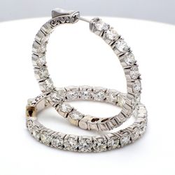 1.5' Inside out hoop earrings with 4-prong set round diamonds.  D12.99ct.t.w.