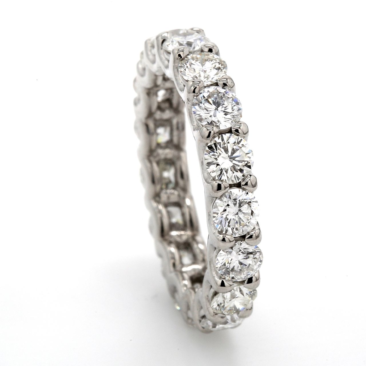 Eternity band in 18K WG with shared U-prong set (19) round diamonds.  D1.81ct.t.w.  Size 4.5