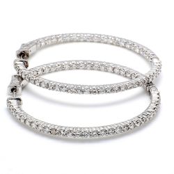 1.25' Inside out hoop earrings with shared prong set round diamonds & with special spring lock.  D2.26ct.t.w.