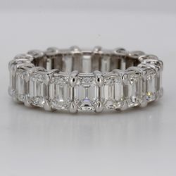 Eternity band in platinum with shared prong basket set GIA certified D-F/VVS1-VS2 (18) emerald cut diamonds.  D8.46ct.t.w.  Size 6.75