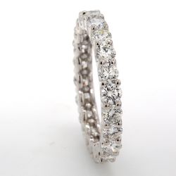 Eternity band in 18K EG with U-prong set (22) round diamonds.  D1.77ct.t.w.  Size 5