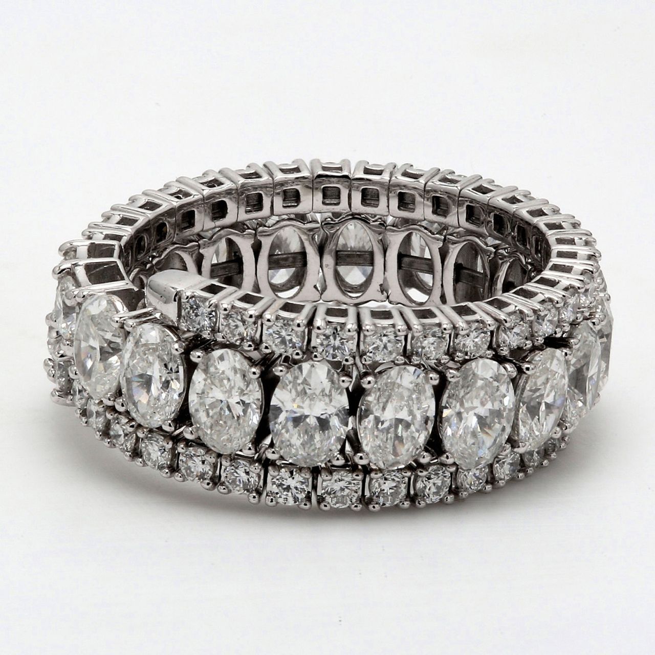 Flexible eternity tri-band style in 18K WG with prong set oval & round diamonds.  D4.58ct.t.w.