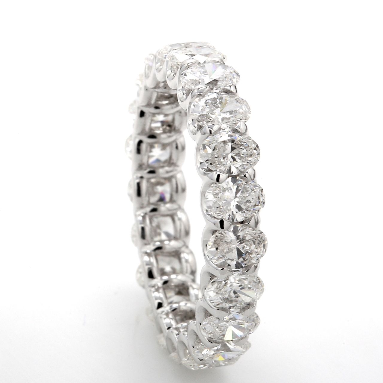 Eternity band with shared U-prong set E-F/VS+ (21) oval diamonds.  D3.01ct.t.w.  Size 5.75