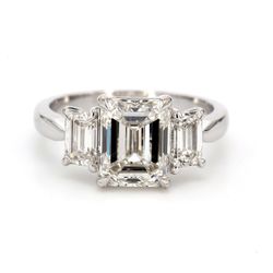 3-stone semi-mount in platinum with GIA certified I/VS1-VS2 emerald cut diamond sides.  D1.01ct.t.w.  Size 6.25