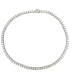 16' Tennis necklace in 18K WG with open basket prong set (88) round diamonds.  D26.90ct.t.w.