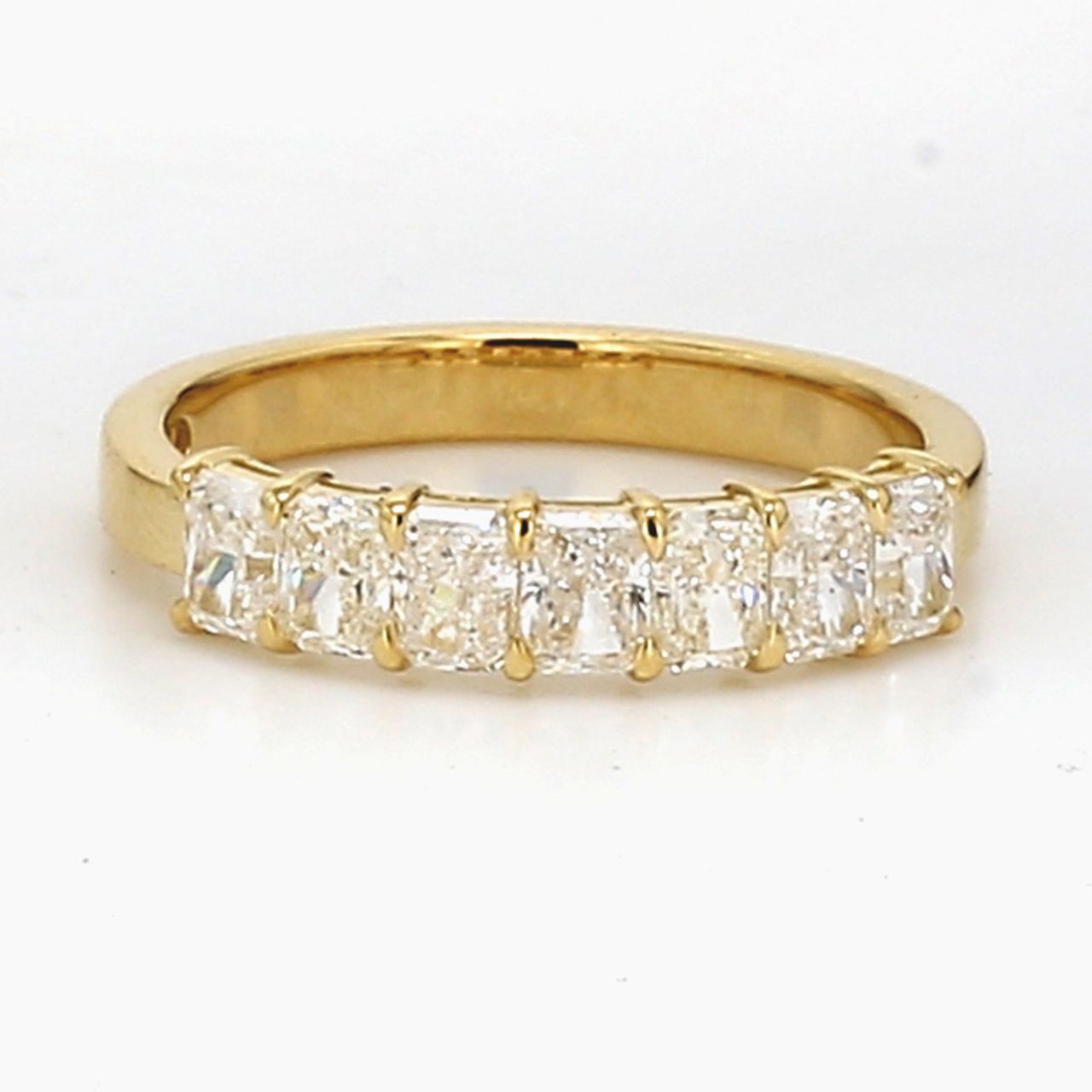 7-stone band in 18K YG with basket prong set radiant cut diamonds.  D1.03ct.t.w.  Size 5.5